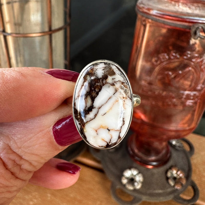 Wild Horse sterling silver ring held in hand, showing the scale of the 12.5 carat oval stone